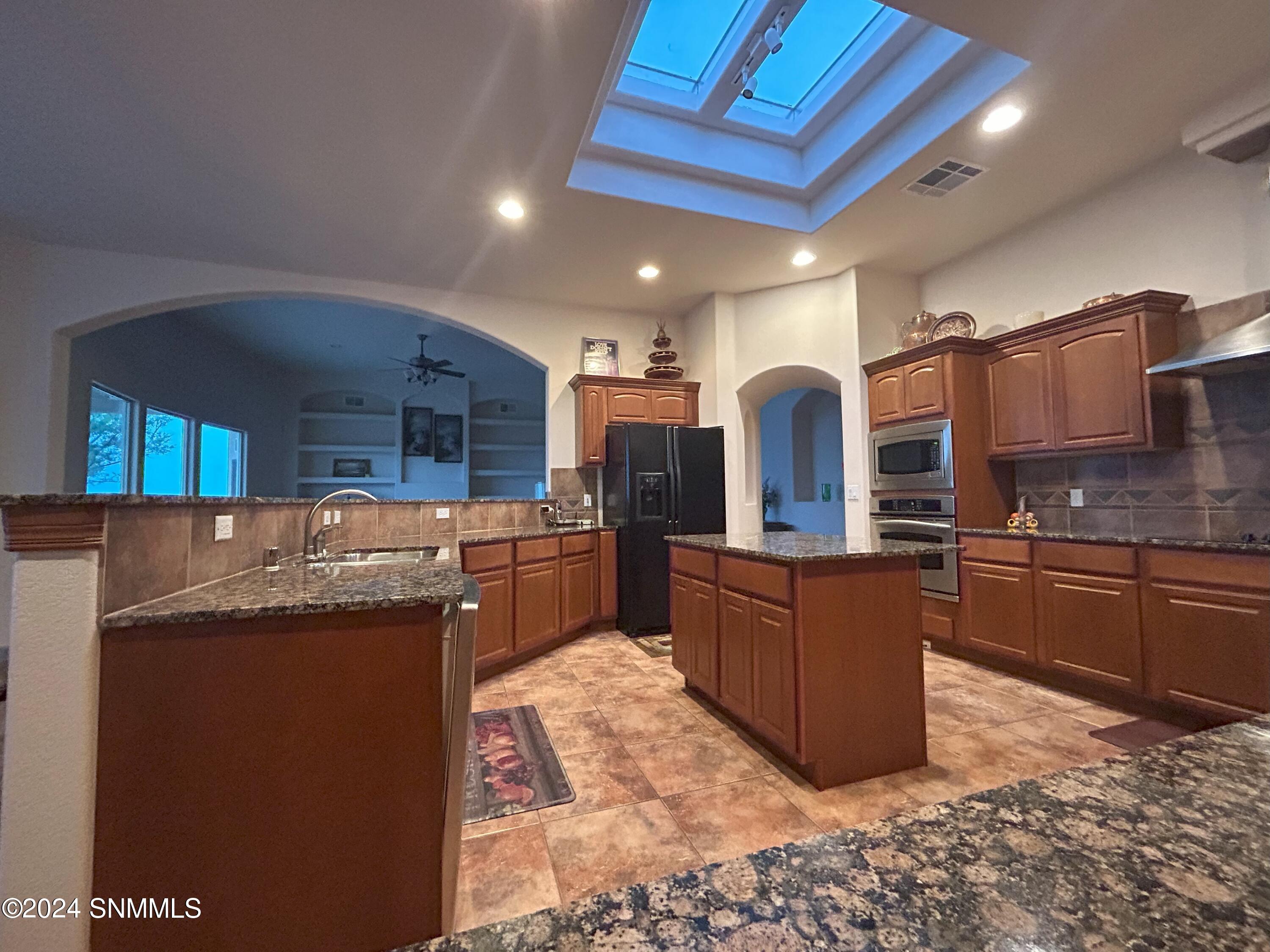 11. Kitchen Showcasing Granite Counterto