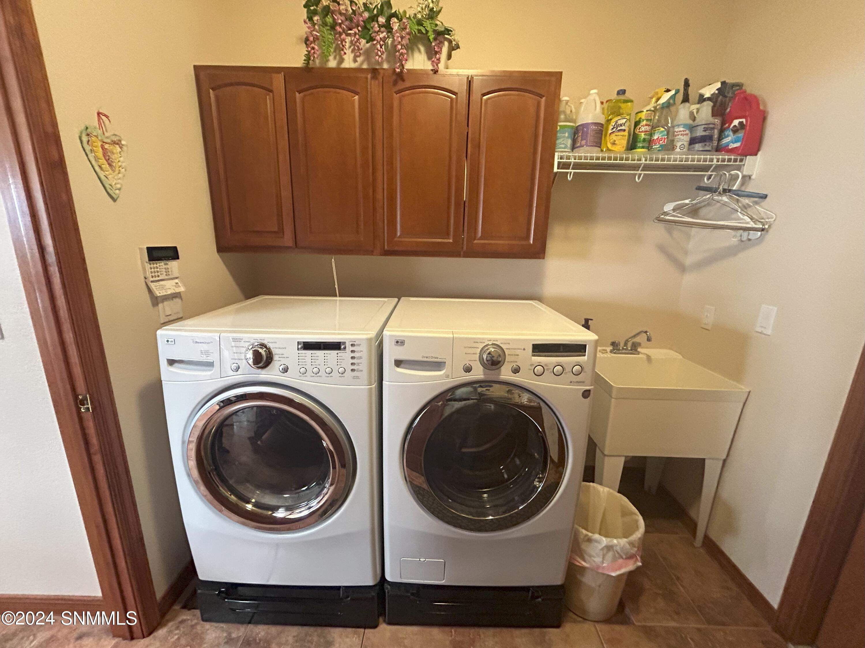 15. Laundry Room with Sink and Cabineets