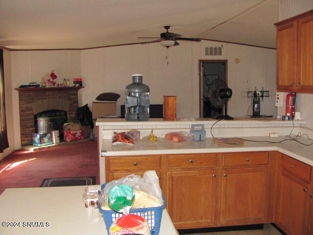 Kitchen looking at LR wood fireplace