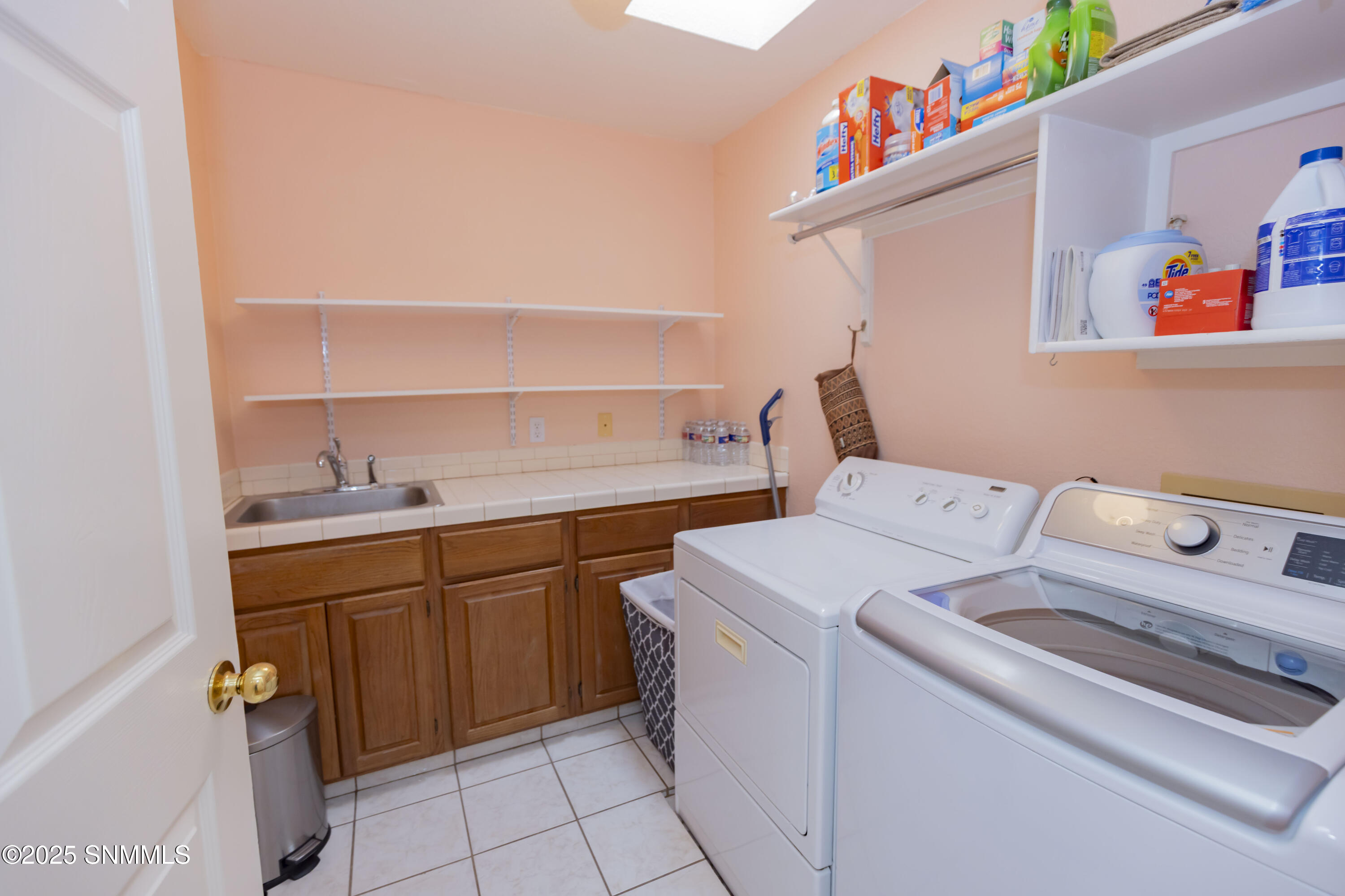 Laundry with sink off kitchen