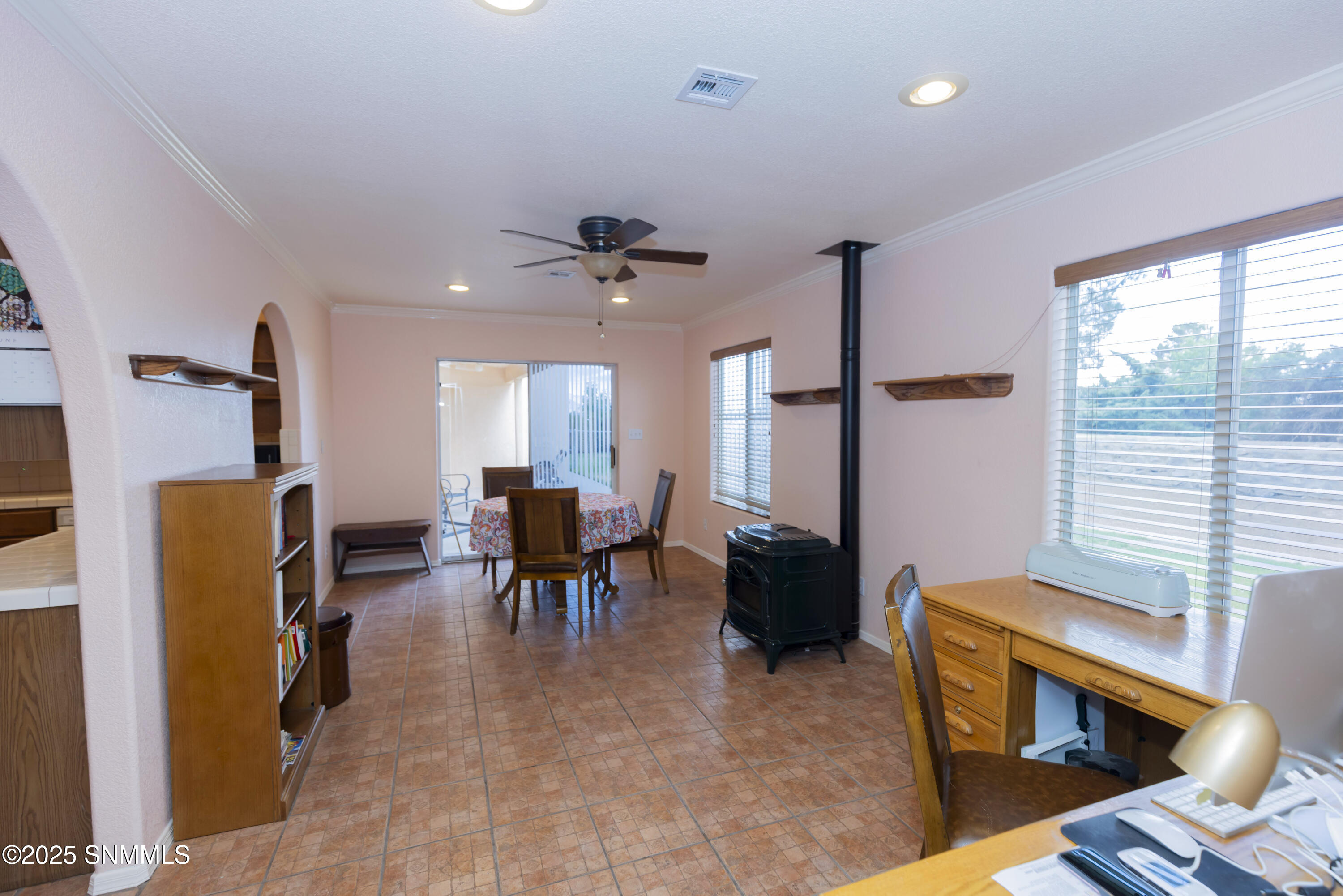 Sunroom with exit to backyard and patio