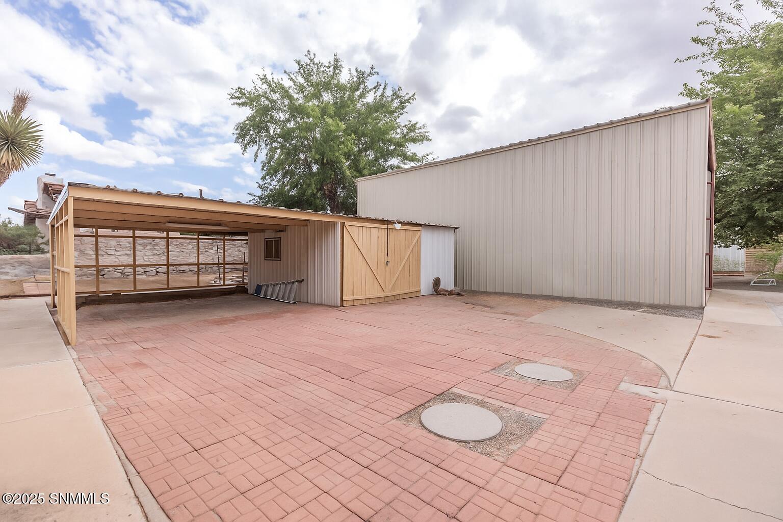 RV garage with covered area and storage