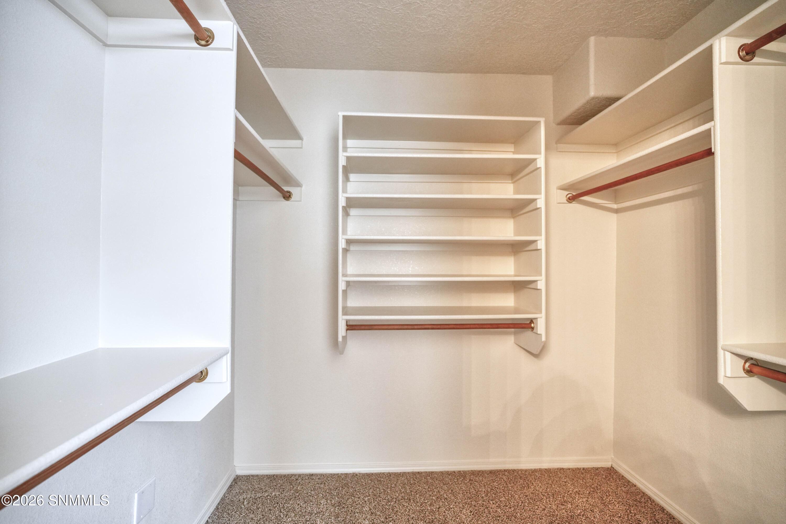 main bedroom walk in closet